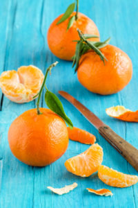 Still life with tangerines on a turquoise-blue wooden table Still life with tangerines on a turquoise-blue wooden table